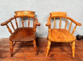 A pair of stained beechwood Captain's Chairs, with spjdle-turned back and supports with double