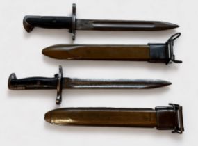 Two US WWII bayonets for the M1 Garrand, 9.5-inch fullered blade, each stamped '1942' to the