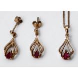 A 9ct yellow gold ruby and diamond pierced pendant and chain, together with a pair of matching 9ct