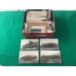 A tin containing approximately 200 standard-size UK and foreign topographical postcards, about 30