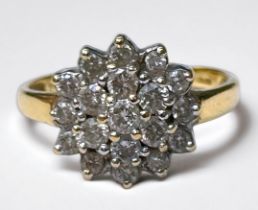 An 18ct yellow gold cluster dress ring, set with 19 x round brilliant cut diamonds, total diamond