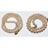 Two rows of cultured pearls, 1st row is 18 inches in length, with 5.0mm white pearls, and a 9ct