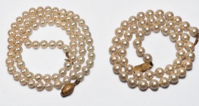Two rows of cultured pearls, 1st row is 18 inches in length, with 5.0mm white pearls, and a 9ct