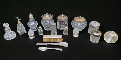 A collection of silver and silver-plate topped and collared toilette bottles and jars, comprising