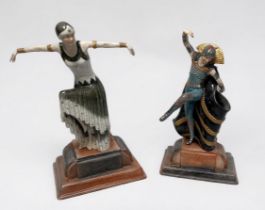 A pair of Art Deco style ceramic figures of flapper dancers, raised on shaped bases, largest