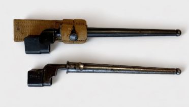 Two Enfield No.4 Mark II spike or 'Pig Sticker' bayonets, with metal scabbards, one with webbing