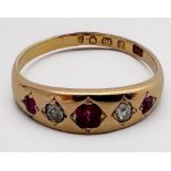 An 18ct yellow gold ruby and diamond ring, hallmarked 1877, ring weighs 3.9 grams.