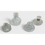 Four late Georgian cut-glass scent bottles including one with silver collar, (4)