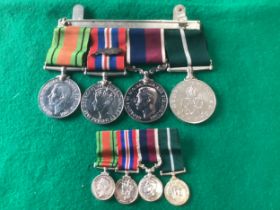 A set of four RAF medals – plus the miniature copies - awarded to Flight Sgt J.E. Wood of the RAF (