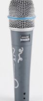 A signed concert-used Shure Beta 57A microphone, signed to the side in silver ink ‘Love, Noel