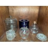 A Smith's Crisps glass storage jar and cover with etched branding, together with a glass wasp trap