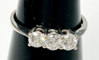 An 18ct white gold three stone diamond ring, estimated total weight 0.60cts, ring weighs 2.6 grams.