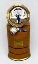 A scarce Omega watch retail/dealer display stand, modelled with two interlocking and rotating