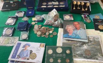 A box containing coins and other collectables (see first photo for all items), including a display