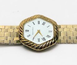 A vintage 9ct gold cased Bueche-Girod wristwatch, the hexagonal white enamel dial with Roman