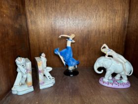 Two various porcelain figures of Art Deco period girls, together with a pair of Art Deco figural