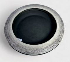 A studio pottery bowl in the 'style' of Hans Coper, of compressed globular disc form, with