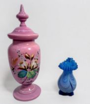 A Nailsea clear blue and opaque white glass vase, of baluster form with typical 'feather' decortion,