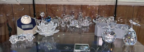 A good collection of assorted Swarovski crystal figures, predominantly boxed examples, including a