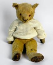 A vintage plush teddy bear, with five-piece jointed body, leather feet-pads and hands, (af)
