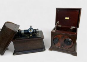 A Thomas Edison Standard Phonograph, with black and silvered label, cylinder and winding crank, on a