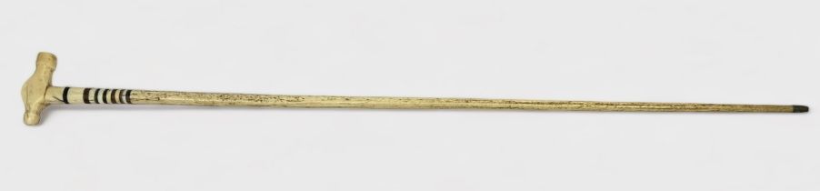 A 20th Century Whale Bone walking stick, with collared sections of horn and the handle carved in the