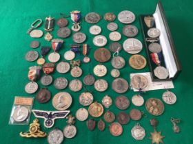 A mixed group of approximately 60 medallions and medals including a badge for the Royal Marines (see