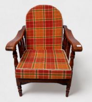 A 20th Century stained beech and ash metamorphic low-seated reclining chair, Windsor 'style' wheel