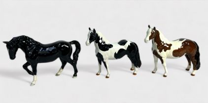 A Beswick 'Stocky Jogging Mare,' model No. 855, BCC 2005, black gloss, together with a 'Piebald' and