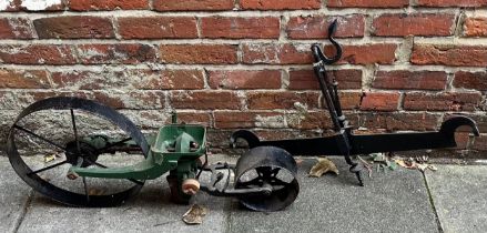 A cast iron garden seed drill, together with a set of iron balance scales