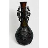 A Chinese cast and patinated bronze vase, late Qing Dynasty, of globular form with elongated neck