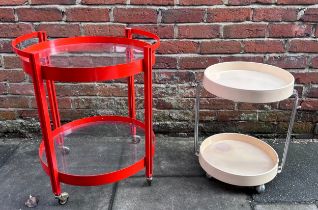 A 1970s/80s red metal circular two-tier drinks trolly with glass top and undertier, 58cm diam,