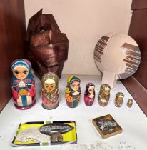 A seven-piece painted wooden Russian Doll, 19cm high, together with four fossils, a moden copper