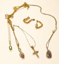Four various 9ct gold pendant and chains, including tanzanite, emerald, amethyst, and diamond cross,