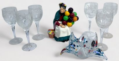 A Royal Doulton porcelai figure "The Balloon Lady,' together with a set of six Stuart Crystal wine