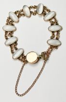 A 10ct gold chain bracelet, set with nine oval shaped moonstones in rub-over settings, weight 16.5