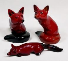 Three Royal Doulton Flambe models, seated fox x2 (one a 1904-2004 Centenary model, and a small model