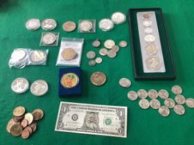 A quantity of commemorative, silver and other USA coins, all in our first photo. This lot includes