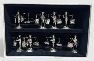 A set of eight Hong Kong silver menu/place-card holders, modelled as fisherman street vendors,