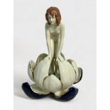 A Royal Dux porcelain figure of a nymph emerging from a waterlily, applied triangle mark to base and
