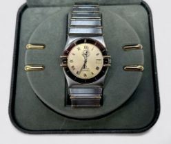 A stainless steel and gold Omega Constellation quartz wristwatch, the champagne dial with applied