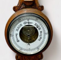 A Victorian aneroid barometer with exposed movement and bellows, and mercury thermometer with dual