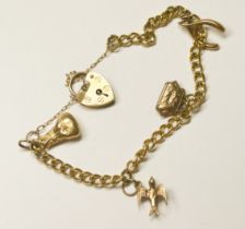 A 9ct yellow gold curb-link bracelet, and four charms, including a money bag, a wishbone, a bird,