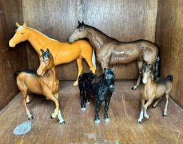 Four assorted Beswick horses, comprising, two large racehorses, Palomino gloss and brown gloss