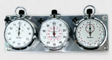 A set of three chrome Hanhart stopwatches, each with white enamel dials, winding crowns to top and