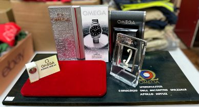 A collection of assorted Omega authorised dealer shop displays, including base section advertising