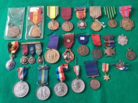 Various medals and medallions in different metals, some with military interest (see top row of