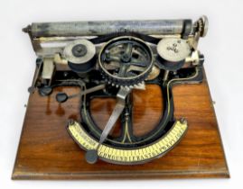 A rare wheel indexing typewriter, invented by Carl Sjoberg of Brooklyn, New York, made by the Garvin