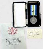 An ERII South Atlantic Medal, with rosette on ribbon, Mercantile Marine, named to V.E. Day, with