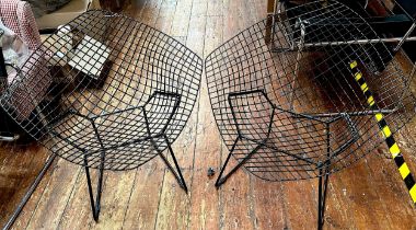 Afert Harry Bertoia and designed c1952, a pair of black Diamond Chairs